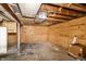 Spacious unfinished basement with wood paneled walls and concrete floor, ready to be customized at 1101 E Loretta Dr, Indianapolis, IN 46227