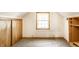 Neutral bedroom with carpet, window letting in lots of natural light, and built in storage at 1101 E Loretta Dr, Indianapolis, IN 46227