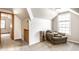 Upstairs bonus room with cozy chair, lots of light, neutral colors, and carpet flooring at 1101 E Loretta Dr, Indianapolis, IN 46227