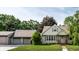 Charming single-story home with a well-maintained lawn, two car garage and inviting front porch at 1101 E Loretta Dr, Indianapolis, IN 46227