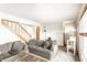 Cozy living room with a staircase, a modern sofa, carpet, and a decorative cat tree at 1101 E Loretta Dr, Indianapolis, IN 46227