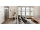 Comfortable living room with large windows, carpet, neutral walls and a cozy couch at 1101 E Loretta Dr, Indianapolis, IN 46227