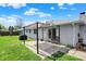 Backyard patio with awning and landscaping at 1111 Cambridge Dr, Greenwood, IN 46142