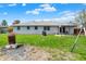 Expansive backyard featuring a well-maintained lawn, patio with gazebo, and white brick exterior at 1111 Cambridge Dr, Greenwood, IN 46142