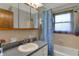 Functional bathroom with shower-tub, vanity, and neutral tile at 1111 Cambridge Dr, Greenwood, IN 46142