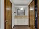Bathroom vanity with mirror and storage at 1111 Cambridge Dr, Greenwood, IN 46142