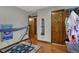 Bedroom with door to hallway, wood laminate floor and storage at 1111 Cambridge Dr, Greenwood, IN 46142