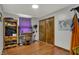 Bedroom featuring closet, desk, and wood laminate flooring at 1111 Cambridge Dr, Greenwood, IN 46142