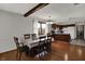 Inviting dining room with hardwood floors, a decorative ceiling, and an open view to the kitchen at 1111 Cambridge Dr, Greenwood, IN 46142