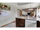 Kitchen area with wood cabinetry, a view to the dining area, and a bright, open feel at 1111 Cambridge Dr, Greenwood, IN 46142