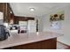 Well-lit kitchen with wooden cabinets, a view to dining area, and ample counter space at 1111 Cambridge Dr, Greenwood, IN 46142