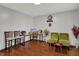 Comfortable living room with a home office setup, hardwood floors, and a Gathering-friendly atmosphere at 1111 Cambridge Dr, Greenwood, IN 46142