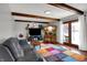 Cozy living room with a brick fireplace, comfortable seating, and lots of natural light at 1111 Cambridge Dr, Greenwood, IN 46142