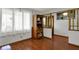 Bright living room with hardwood floors, open staircase, and a view of other living spaces at 1111 Cambridge Dr, Greenwood, IN 46142