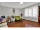 Inviting living room featuring hardwood floors, and abundant natural light from large windows at 1111 Cambridge Dr, Greenwood, IN 46142