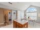 Bright kitchen showcases granite countertops, island, adjacent breakfast nook, and open layout at 1124 Enchanted View Dr, Mooresville, IN 46158