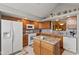 Inviting kitchen features granite countertops, ample cabinetry, and modern appliances at 1124 Enchanted View Dr, Mooresville, IN 46158