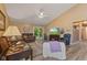 Inviting living room with a cozy fireplace, TV, and comfortable seating; adjacent to the dining area at 1124 Enchanted View Dr, Mooresville, IN 46158
