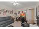 Multi-purpose room acting as a home office and living space, with a TV, desk, and comfortable seating at 1124 Enchanted View Dr, Mooresville, IN 46158