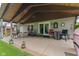 Large covered patio with ample seating and green lawn at 1124 Enchanted View Dr, Mooresville, IN 46158