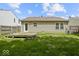 Expansive backyard features a wooden deck and level lawn at 11821 Wapiti Way, Noblesville, IN 46060