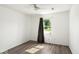 Bedroom featuring wood-look floors, a ceiling fan, and a window for natural light at 11821 Wapiti Way, Noblesville, IN 46060