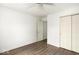 Spacious bedroom featuring wood-look floors, a ceiling fan, and a closet at 11821 Wapiti Way, Noblesville, IN 46060