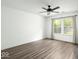 Bright bedroom with laminate flooring, neutral walls, and a large window offering ample natural light at 11821 Wapiti Way, Noblesville, IN 46060