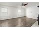 Large living room featuring durable laminate flooring, and a cozy fireplace at 11821 Wapiti Way, Noblesville, IN 46060