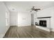 Spacious living room with a fireplace and durable laminate flooring at 11821 Wapiti Way, Noblesville, IN 46060