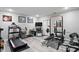 Spacious home gym with modern exercise equipment, a weight rack, and motivational decor at 12335 Old Stone Dr, Indianapolis, IN 46236