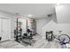 Home gym with weightlifting equipment, a storage system, and a racing bicycle at 12335 Old Stone Dr, Indianapolis, IN 46236