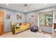 Bedroom with light blue walls, ceiling fan, window, bed and dressers at 12335 Old Stone Dr, Indianapolis, IN 46236