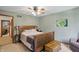 Cozy bedroom features natural light, a wooden bed frame, and an inviting atmosphere at 12335 Old Stone Dr, Indianapolis, IN 46236