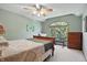 Charming bedroom with a large window offering natural light and traditional furnishings at 12335 Old Stone Dr, Indianapolis, IN 46236