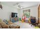 Bedroom with ceiling fan, and window with a desk at 12335 Old Stone Dr, Indianapolis, IN 46236