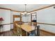 Cozy dining room with decorative chandelier, and antique-inspired buffet cabinet at 12335 Old Stone Dr, Indianapolis, IN 46236