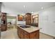 Spacious kitchen featuring granite countertops and a center island with cooktop at 12335 Old Stone Dr, Indianapolis, IN 46236
