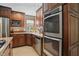 Well-appointed kitchen with stainless appliances and tile backsplash at 12335 Old Stone Dr, Indianapolis, IN 46236