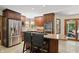Bright kitchen showcasing stainless steel appliances and an adjacent sunroom at 12335 Old Stone Dr, Indianapolis, IN 46236