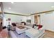 Living room area with a large sectional sofa, fireplace, and stylish decor at 12335 Old Stone Dr, Indianapolis, IN 46236
