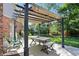 Relaxing outdoor patio featuring a pergola with lights, a table, and comfortable seating at 12335 Old Stone Dr, Indianapolis, IN 46236