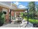 Charming outdoor patio with a pergola, dining set, and lush green surroundings, ideal for outdoor gatherings at 12335 Old Stone Dr, Indianapolis, IN 46236