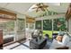 Charming screened-in porch with stylish furniture and scenic outdoor views at 12335 Old Stone Dr, Indianapolis, IN 46236