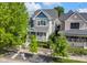 Aerial view of a charming two-story home, surrounded by green trees, with a welcoming front porch at 1322 Marlowe Ave, Indianapolis, IN 46202