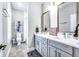 Modern bathroom with double sink vanity, framed mirrors, and stylish finishes at 1322 Marlowe Ave, Indianapolis, IN 46202