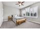 Inviting bedroom with neutral palette, ceiling fan, and large shuttered windows at 1322 Marlowe Ave, Indianapolis, IN 46202