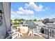 Enjoy outdoor living on this spacious deck with Adirondack chairs and neighborhood views at 1322 Marlowe Ave, Indianapolis, IN 46202