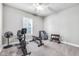 Bright exercise room with stationary bike, weight bench, and free weights at 1322 Marlowe Ave, Indianapolis, IN 46202