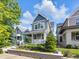Charming two-story home with manicured front yard landscaping and inviting front porch at 1322 Marlowe Ave, Indianapolis, IN 46202